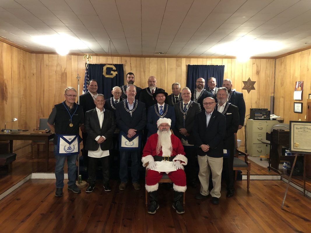 Brothers of the lodge with Santa in the lodge room