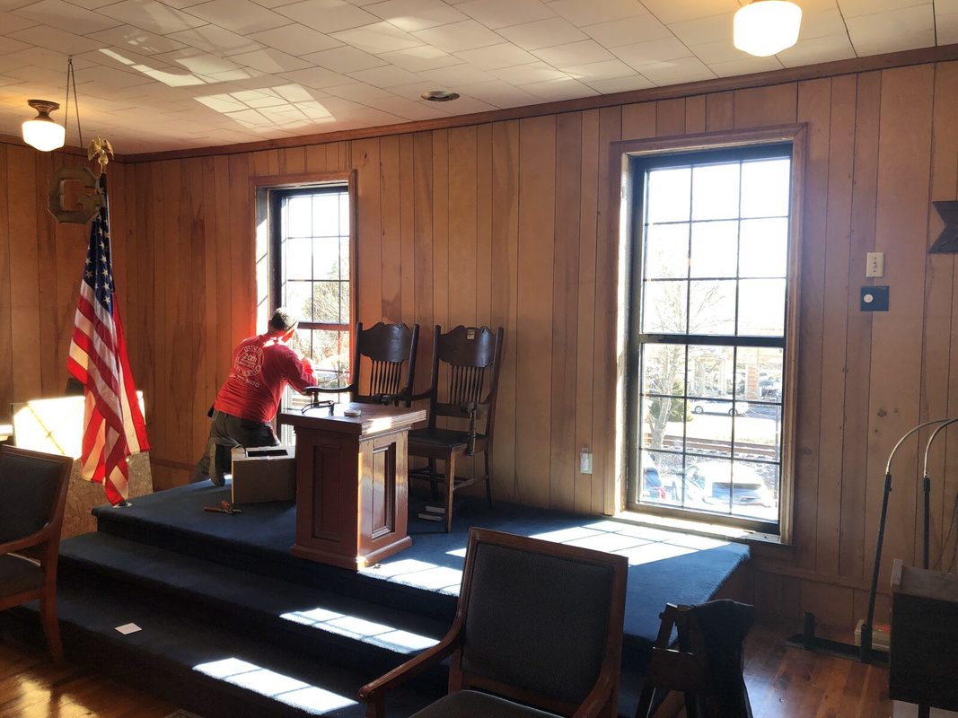 A new window being installed in the lodge room