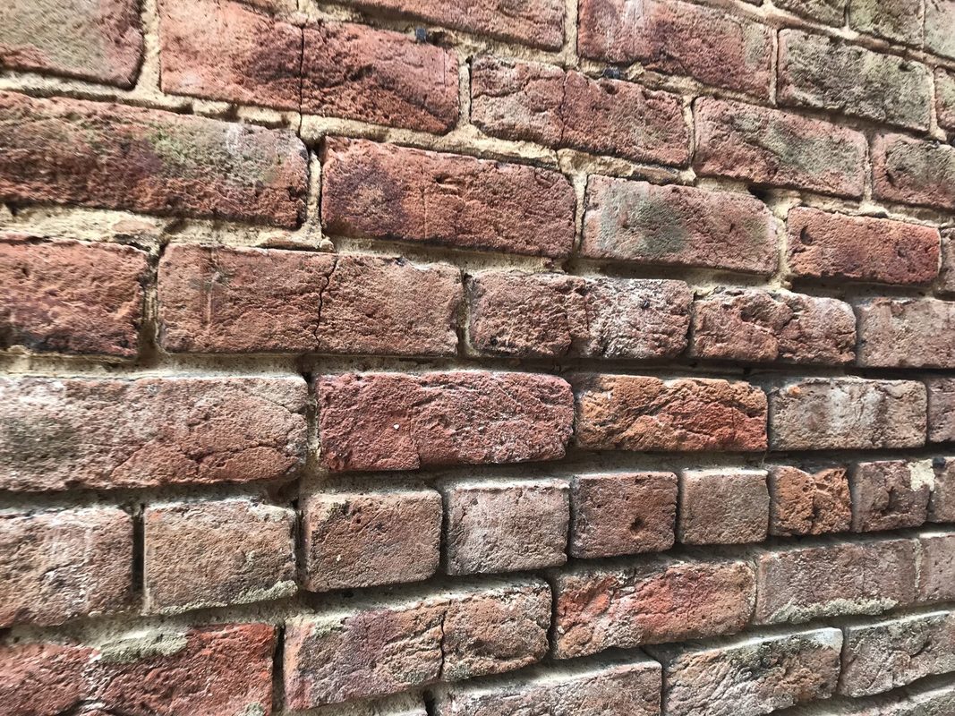 Close view of the old brick wall of the lodge