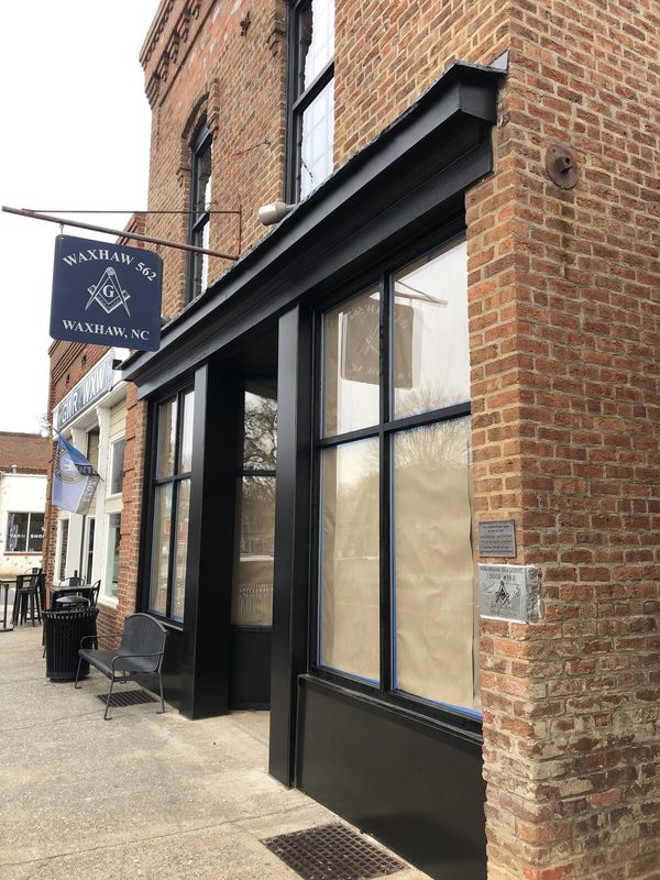 The new storefront and hanging lodge sign on Main Street