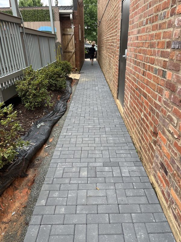 The finished paver walkway along the side of the lodge